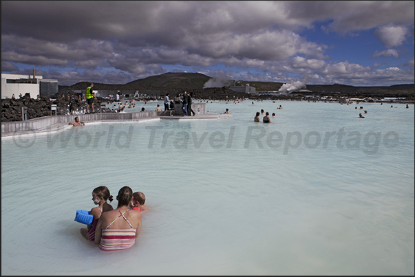Blue Lagoon. The large public swimming pool with warm waters and white sludge used as a beneficial treatment for the skin Blue Lagoon. The large public swimming pool with warm waters and white sludge used as a beneficial treatment for the skin