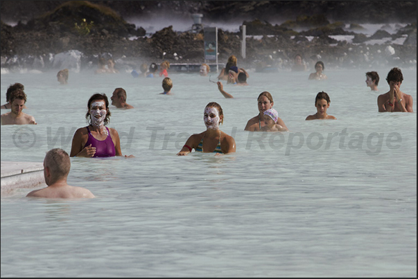 Blue Lagoon. The large public swimming pool with warm waters and white sludge used as a beneficial treatment for the skin Blue Lagoon. The large public swimming pool with warm waters and white sludge used as a beneficial treatment for the skin