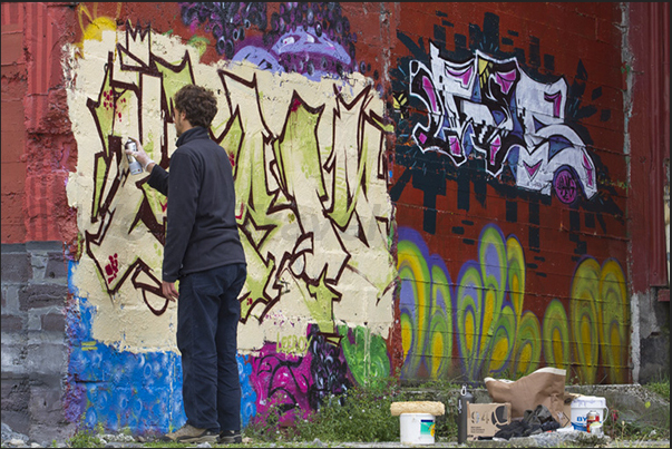 A mural artist at work