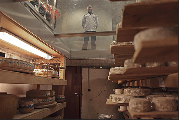 The owner controls the maturing of cheeses in his cellar The owner controls the maturing of cheeses in his cellar