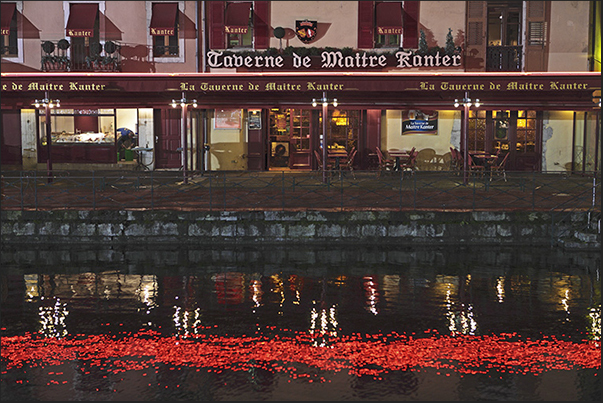 The Christmas lights are reflected on the waters of the canal The Christmas lights are reflected on the waters of the canal