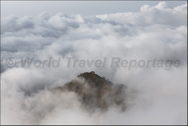 Over thousand meters, the fog ends and you discover the clouds on the plains