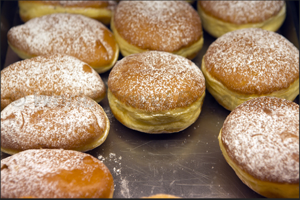 Krapfen, traditional pastries filled with cream or jam Krapfen, traditional pastries filled with cream or jam