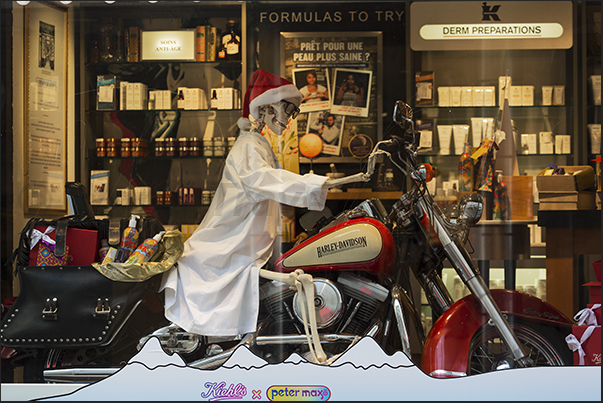 Skeleton on a motorcycle in the window of a pharmacy