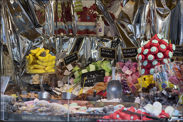 A stand with candied fruit, candy and sweets A stand with candied fruit, candy and sweets