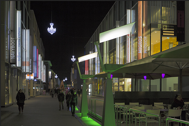 The illuminated avenue that crosses the modern district Flon The illuminated avenue that crosses the modern district Flon