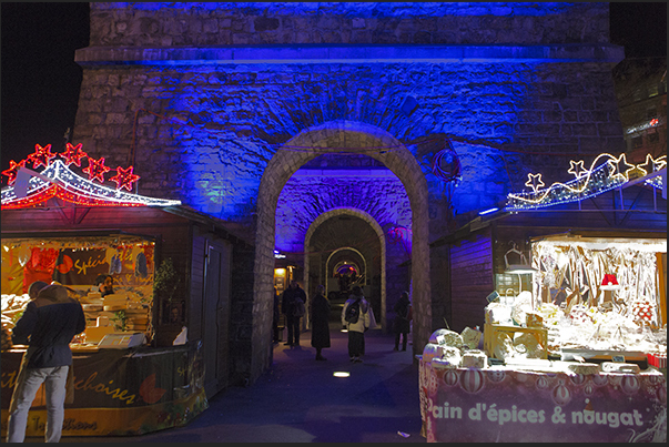 Among the stone arches in the Europa square, pubs and Christmas stands Among the stone arches in the Europa square, pubs and Christmas stands
