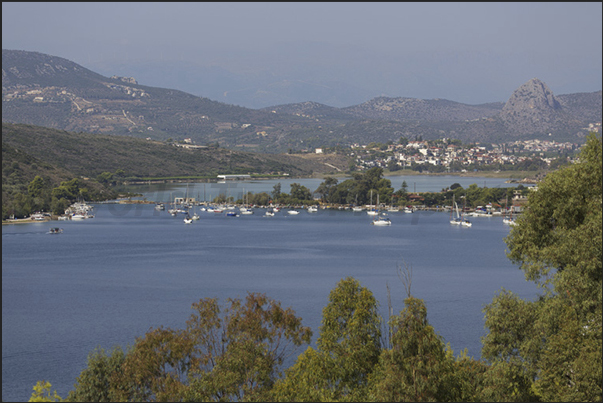 Boats in the harbor and behind, the lagoon and the city of Drepano