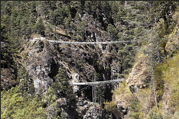 The two suspension bridges to Larja Dobhan at the confluence of the valleys of the rivers Bhote Koshi and Dudh Koshi The two suspension bridges to Larja Dobhan at the confluence of the valleys of the rivers Bhote Koshi and Dudh Koshi