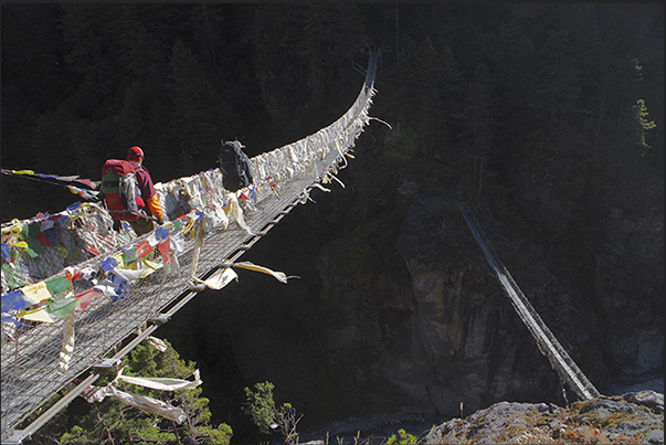 The two suspension bridges to Larja Dobhan at the confluence of the valleys of the rivers Bhote Koshi and Dudh Koshi The two suspension bridges to Larja Dobhan at the confluence of the valleys of the rivers Bhote Koshi and Dudh Koshi