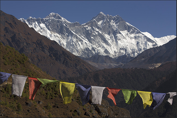 Along the path to Tengboche, Mount Lhotse (8516 m), almost hides the Mount Everest (8848 m) behind him Along the path to Tengboche, Mount Lhotse (8516 m), almost hides the Mount Everest (8848 m) behind him