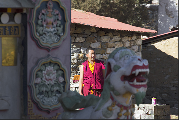 Monk at the entrance to Tengboche Monastery Monk at the entrance to Tengboche Monastery