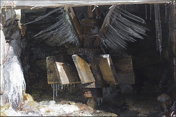On the blades of a water mill, you see the splash of water transformed in ice overnight On the blades of a water mill, you see the splash of water transformed in ice overnight
