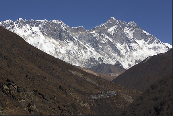 Mount Lhotse in the end of the valley and below, the village of Shomare (4010 m) Mount Lhotse in the end of the valley and below, the village of Shomare (4010 m)