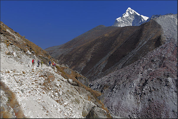 4200 m. The trees are gone and the trail climbs up through stones and gravel 4200 m. The trees are gone and the trail climbs up through stones and gravel