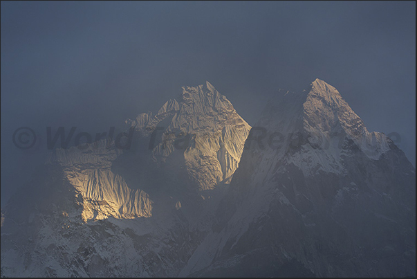 In the evening, low clouds envelop the mountains around Dingboche