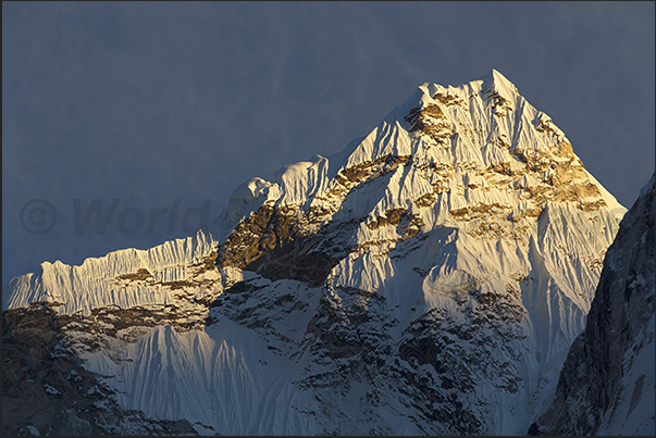 Sunset on Mount Ama Dablam (6814 m) while the village of Dingboche (4410 m) is already in the dark