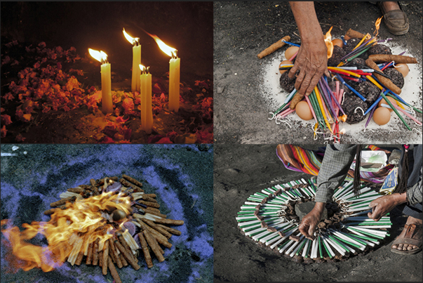 Moments of sacred rites with candles of various colors, flowers, eggs, cigars, chocolate and copal, a resin extracted from pine trees Moments of sacred rites with candles of various colors, flowers, eggs, cigars, chocolate and copal, a resin extracted from pine trees