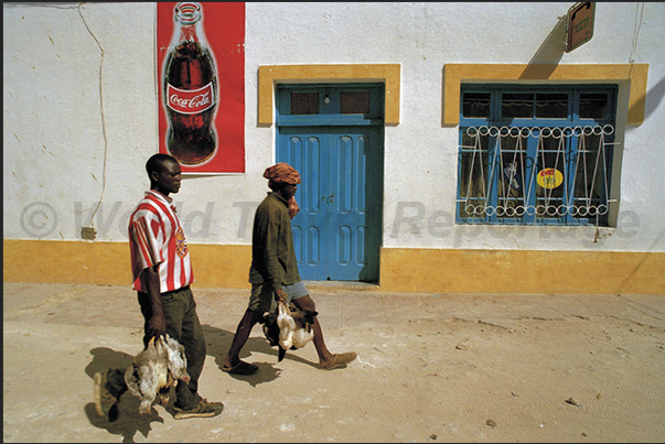 In the streets of the town, is a constant coming and going from the market