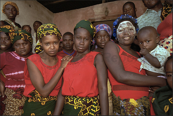 A group of women waiting the bride at the end of the wedding ceremony