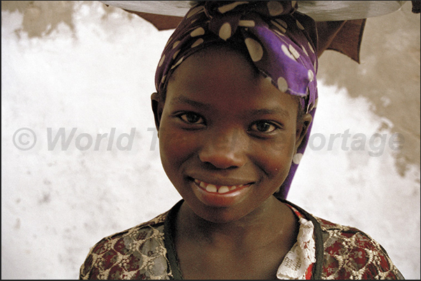Children play in the streets or help their parents to the market or the fathers when come back from the fishing Children play in the streets or help their parents to the market or the fathers when come back from the fishing