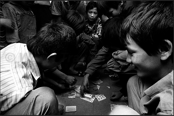 Hanoi. Gambling in the streets of the old quarter of the town Hanoi. Gambling in the streets of the old quarter of the town