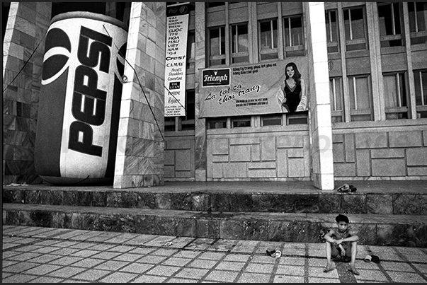 Hanoi. A football player sitting in front of a football door made with shoes