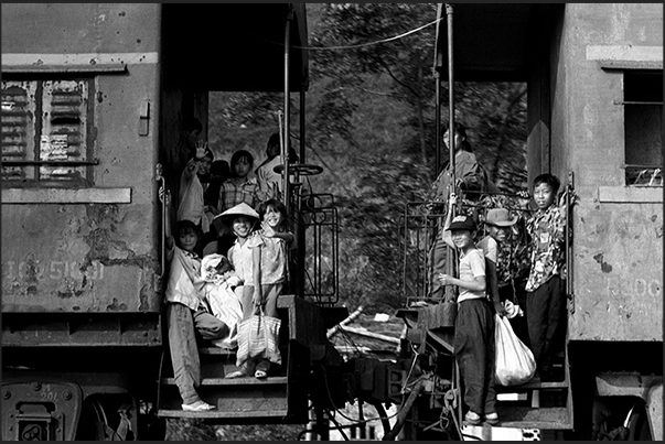 A train runs along the road leading up to the Central Highlands