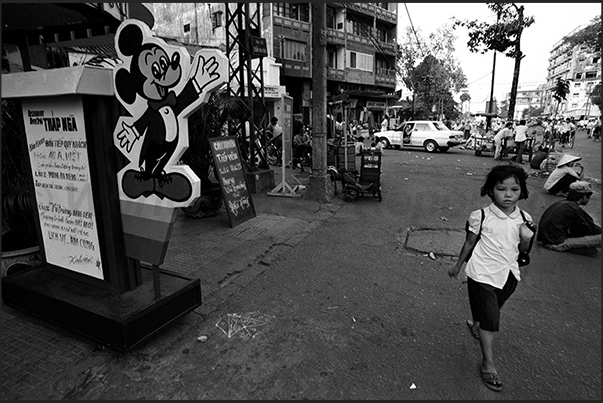 Ho Chi Minh City (Saigon). Mickey Mouse in front of a karaoke restaurant Ho Chi Minh City (Saigon). Mickey Mouse in front of a karaoke restaurant