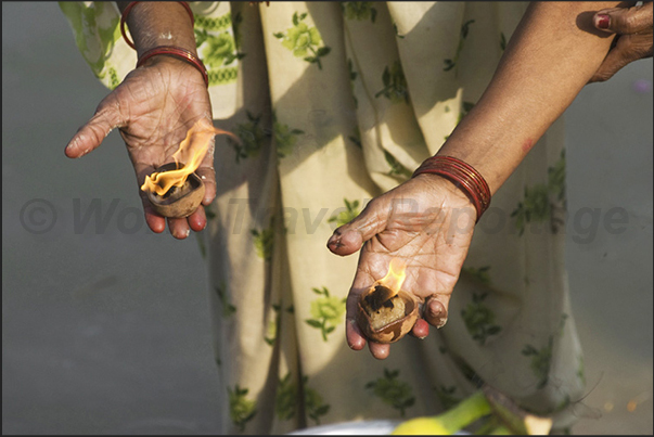 The purifying fire in the hands of a woman