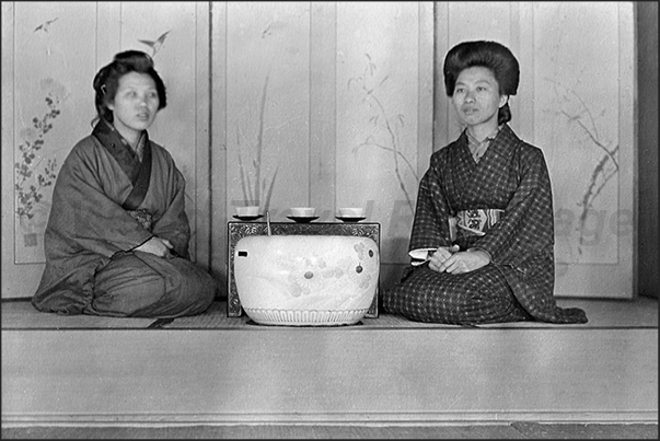 Japan. Yokohama. Two women in the tea room Japan. Yokohama. Two women in the tea room