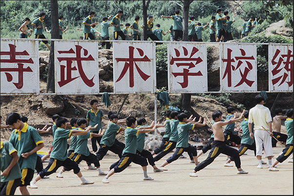 Shaoling. Martial Arts Schools. The kids learn kung fu in the school squares