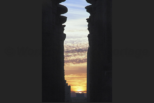 Sunset between the columns of Karnak temple