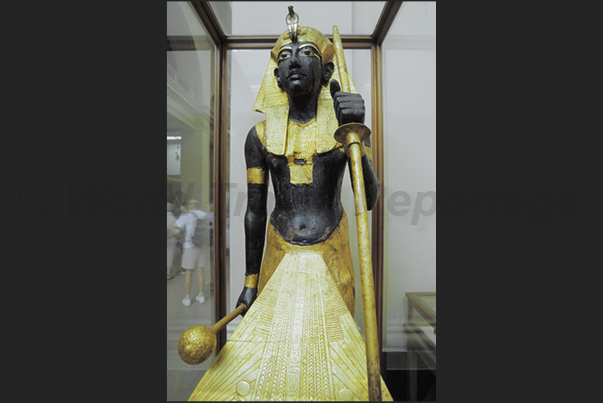 Cairo. Egyptian museum. Treasure tomb of Tutankamon. The statue of the pharaoh guarding his treasure