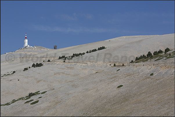 The telecommunications tower on the top of the mountain and the vast stony ground on the south side of the mountain The telecommunications tower on the top of the mountain and the vast stony ground on the south side of the mountain