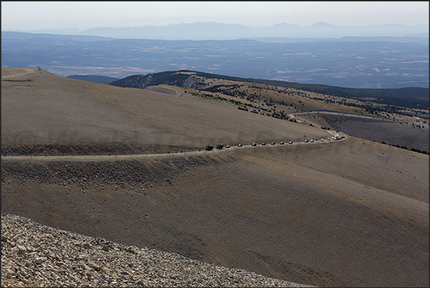 The road that crosses the warm and sunny stony ground that covers the top of the mountain