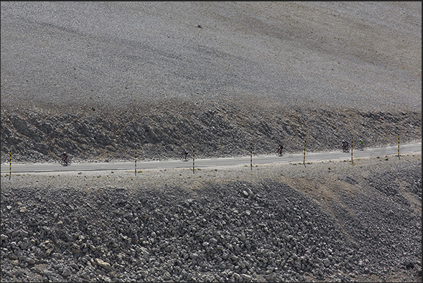 The road that crosses the warm and sunny stony ground that covers the top of the mountain