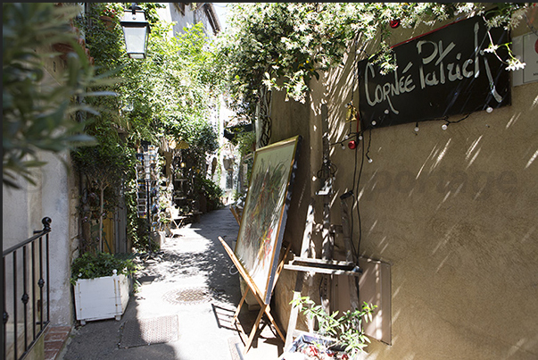 Alleys of the old town with the art galleries on Rue des Lombards