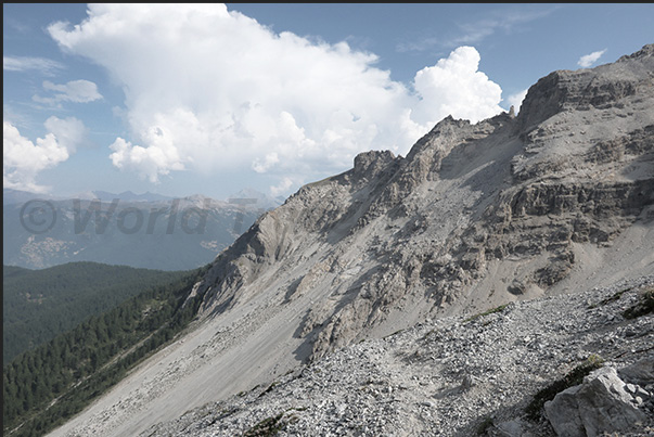 A narrow path between the rocks descends from the Orso Pass (2,481 m) towards Chateau-Beaulard (1,387 m) A narrow path between the rocks descends from the Orso Pass (2,481 m) towards Chateau-Beaulard (1,387 m)