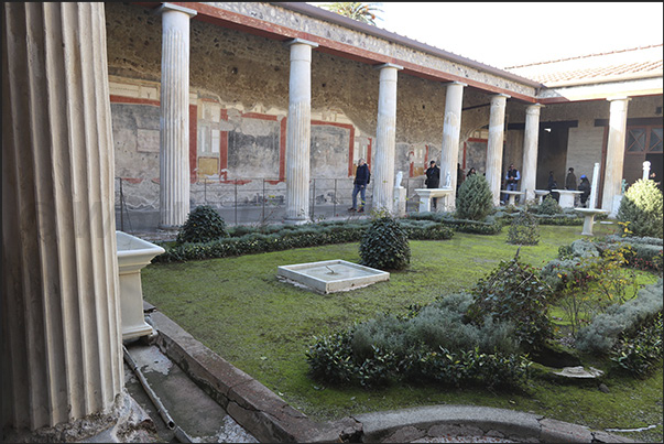 The columned patio in the center of the villa with well-preserved frescoes of Roman life and culture on the walls