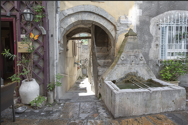 Ancient stone fountains are present in the small squares of the village