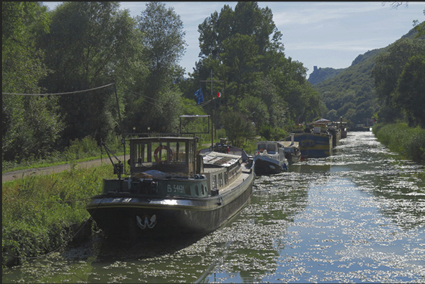 Peniches (typical French river boat) moored along the Rhin-Rhone Canal
