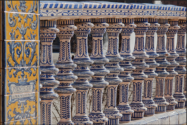 Sevilla, Plaza de Espańa (Spain Square). The ceramic columns of the bridges crossing the channel of the square Sevilla, Plaza de Espańa (Spain Square). The ceramic columns of the bridges crossing the channel of the square