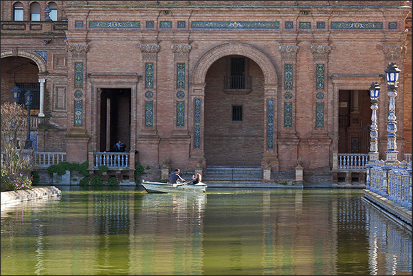 Sevilla, Plaza de Espańa (Spain Square). Romantic boat trip in the channel of the square