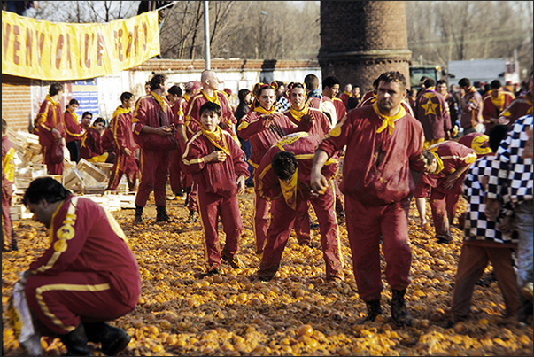 In the evening, streets and squares are covered by a layer of oranges destined to be destroyed and not eatable In the evening, streets and squares are covered by a layer of oranges destined to be destroyed and not eatable