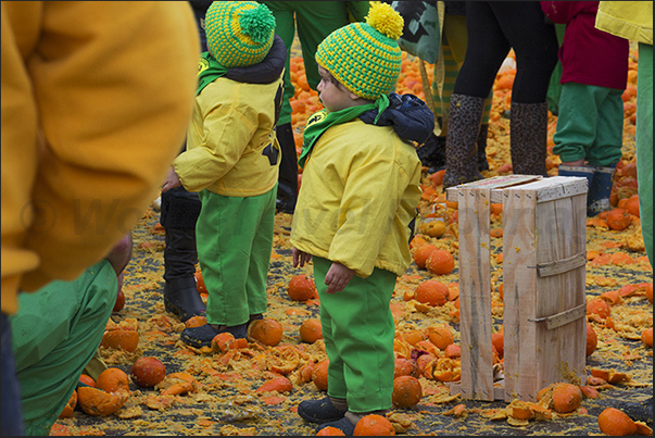 In the evening, streets and squares are covered by a layer of oranges destined to be destroyed and not eatable In the evening, streets and squares are covered by a layer of oranges destined to be destroyed and not eatable