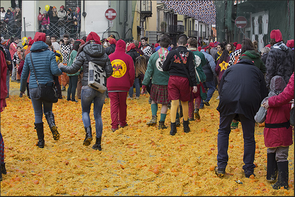 In the evening, streets and squares are covered by a layer of oranges destined to be destroyed and not eatable In the evening, streets and squares are covered by a layer of oranges destined to be destroyed and not eatable