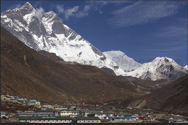 The village of Dingboche dominated by Mount Lhotse (8516 m) on the left and Mount Island Peak (6189 m) to the right