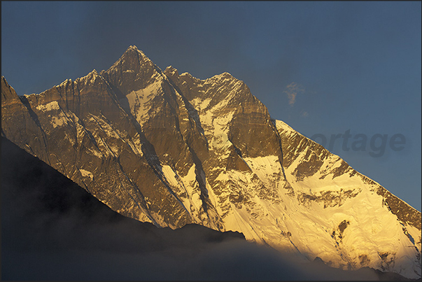The last ray of sunlight on the Mount Lhotse (8516 m)