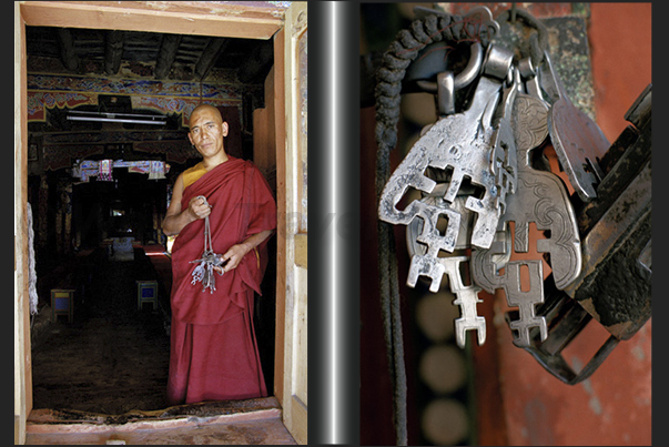 A monk with a bunch of keys in his hand, at the door of a room of the monastery A monk with a bunch of keys in his hand, at the door of a room of the monastery